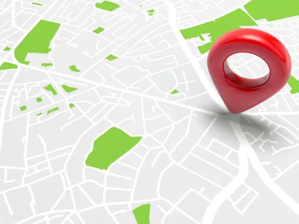 Large red location pin marker on detailed city map graphic in business directory